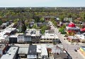 Aerial view of a small rural community with a mix of residential and commercial buildings.