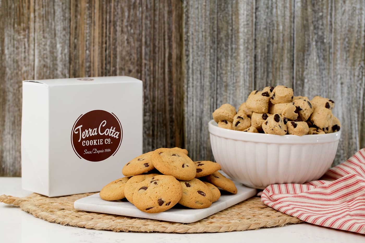 Cookies are present on a plate with a box nearby labelled 'Terra Cotta Cookie Co.'