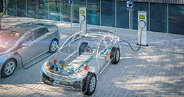 An electric vehicle charging at a station